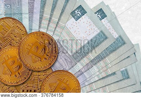 5 Egyptian Pounds Bills And Golden Bitcoins. Cryptocurrency Investment Concept. Crypto Mining Or Tra