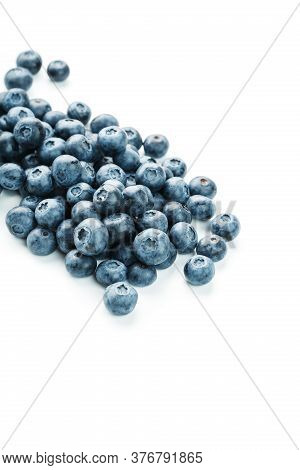 Tasty Blueberries Fruit Are Scattered On A White Background.