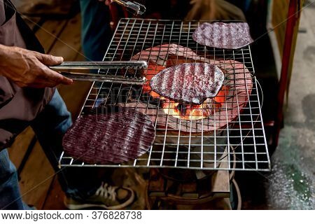 People Making Snacks Grill With Charcoal Stove Has A Name Called Puk, Which Sesame Rice Is A Meal Or