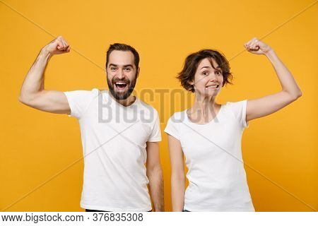 Strong Young Couple Friends Bearded Guy Girl In White Empty Blank T-shirts Posing Isolated On Yellow