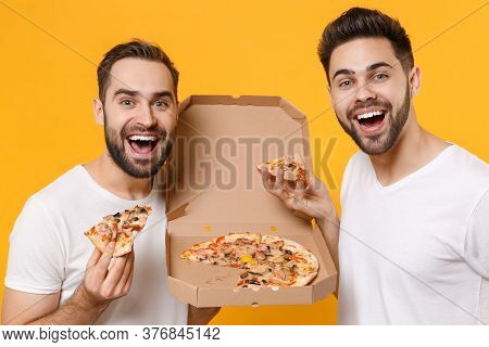 Close Up Of Cheerful Young Men Guys Friends In White Blank T-shirts Posing Isolated On Yellow Orange