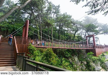Busan,south Korea - July 20, 2017:  The Wooden Suspension Bridge On The Rock Cilff In Haeundae Dongb