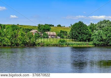 Rural Estates On The Shore Of A Pond In The Village Of Ugroidy (sumy Region, Ukraine). Beautiful Ukr