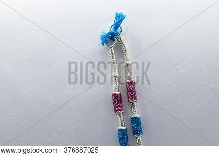 Silver Leg Chain Design With Red And Blue Stones On The White Background (anklet)