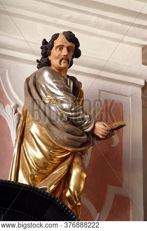 ZAGREB, CROATIA - MAY 16, 2013: Saint Luke the Evangelist, altar of the Holy Spirit in the Church of Saint Catherine of Alexandria in Zagreb, Croatia