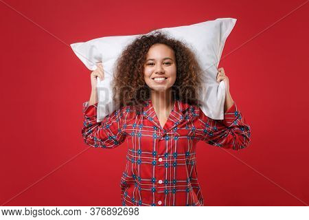 Smiling Young African American Girl In Pajamas Homewear Posing While Resting At Home Isolated On Red
