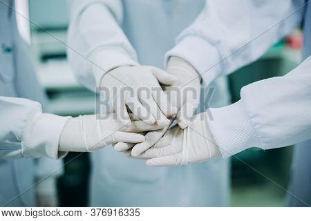 Hand Together Of Medical Doctor In Research Scientist Laboratory. Concept For Collaboration Of Healt