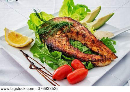 Spicy Tasty Fried Fish Piece With Salad On Plate