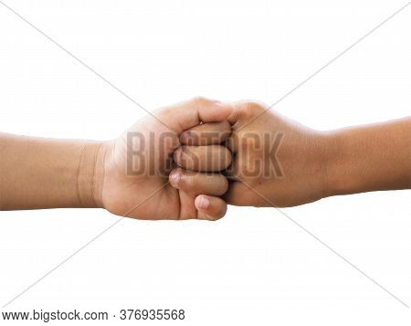 Boy  Fist Bumping On A White Background.
It Is A New Greeting During The Covid Virus Epidemic Preven