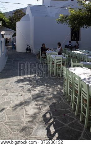 Folegandros, Cyclades / Greece / September 16 2019 : Late Afternoon In A Sunlit Square In The Island
