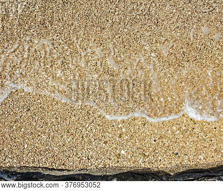 Small-pebble Beach With A Calm Gentle Sea Of The Adriatic In Croatia
