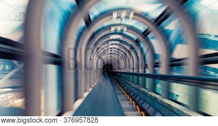 Abstract Motion Blurred View Through An Escalator Tunnel