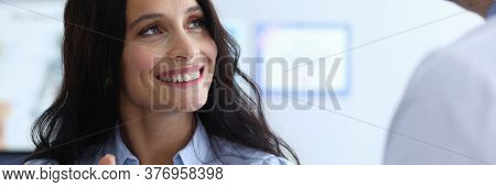 Close-up Of Cheerful Lady Looking At Doctor With Smile. Beautiful Female At Consultation With Plasti