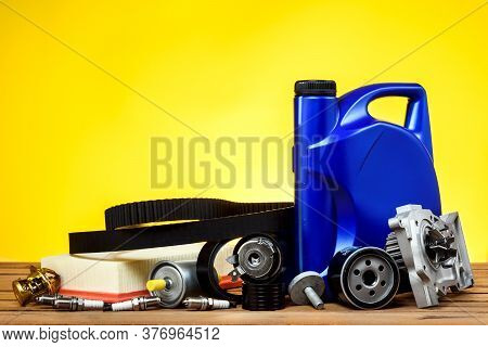 Various Spare Parts For The Car. The Set Of Timing Belt With Rollers, Cooling Pump, Motor Oil, Spark