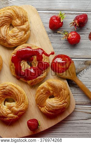 A Homemade Cruller Donuts With Strawberry Jam