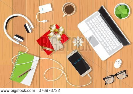 Christmas Decorations Top View With Textured Table, Laptop, Glasses, Gift Box And Coffee Mug. Desk V