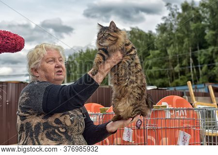 Russia, Sertolovo, Leningrad Region, 13,08,2016: : Unidentified Member Of The Exhibition Shows His C