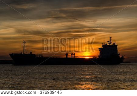 Sunset Over The Ship - Seascape In A Romantic Evening
