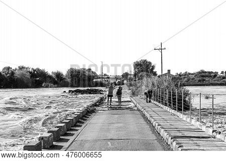 Kanoneiland, South Africa - Feb 25, 2023: The Eendrag Bridge Over The Flooded Orange River At Konone
