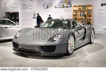 Toronto, Canada - 02 25 2023: Seal Grey Porsche 918 Spyder Two-door Plug-in Hybrid Sports Car Displa