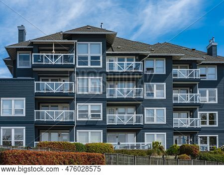 Facade Of New Residential Townhouses. Apartment Buildings In Canada. Modern Complex Of Apartment Bui