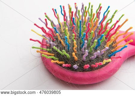 A Multicolored Comb With Fallen Hair. Hair Care. Problems, Hair Loss. Trichologist, Hair Care Proced