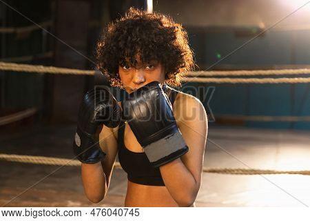 Outcry Independent Girl Power. Angry African American Woman Fighter With Boxing Gloves Looking Serio