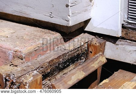 Porch Reconstruction With Dismantled Old Brickwork And Wooden Foundation Of The Porch Steps. Decking