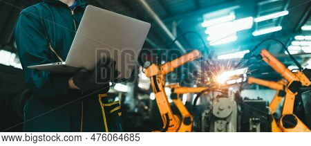 Engineer Use Advanced Robotic Software To Control Industry Robot Arm In Factory . Automation Manufac