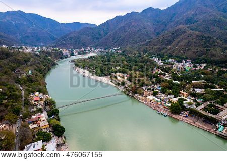 Aerial Drone Shot Of Blue Water Of River Ganga Stretching Into Distance With Himalayas With Ram Setu