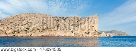 Summer Rocky Coastline And Military Base On Rock Top. Alchak Cape, Sudak Town Environs, Crimea, Ukra