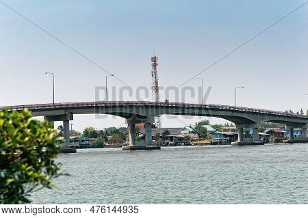 The Scenery Of The Bang Tabun Bridge In  Phetchaburi, Thailand, With Houses Are Along The Coast Of T