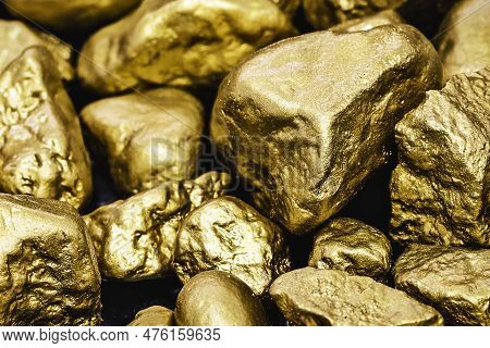 Golden Nuggets Isolated On Black Background. Luxury Concept And Gold.