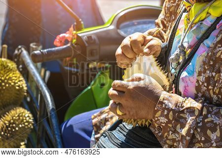 Elderly Thai Female Vendor Ride Motorcycle Selling Durians And Fruits And Vegetables To Tourists At