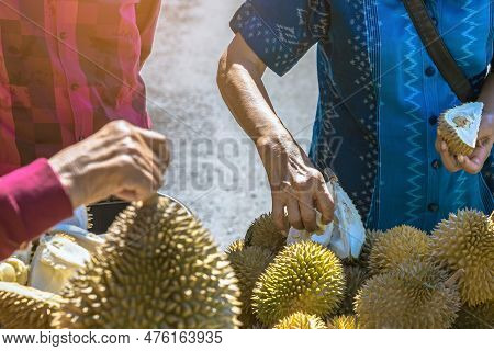 Elderly Thai Female Vendor Ride Motorcycle Selling Durians And Fruits And Vegetables To Tourists At