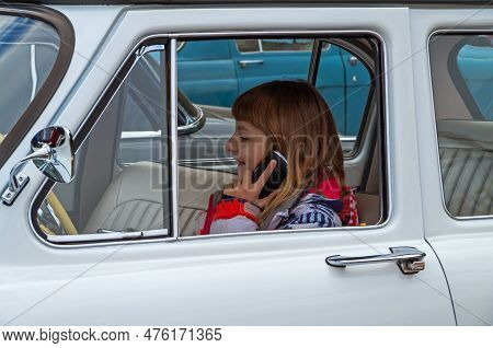 Dnipro, Ukraine - October 06, 2013: Underage Girl Stole Car Keys From Her Father And Got Behind Whee