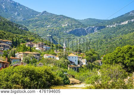 The Landscape Of Doganbay Village And Stone House On A Summer And Sunny Day.