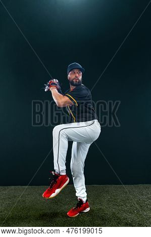 Baseball Player On Dark Background. Ballplayer Portrait.