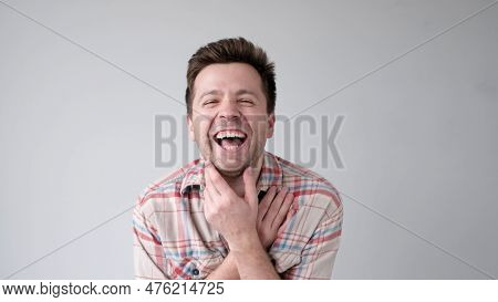 European Funny Young Man Is Laughing Loudly. Positive Emotion