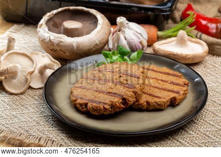 Tasty Vegetarian Burgers Made From Healthy Quinoa, Basil, Portobello Champignon And Shiitake Mushroo