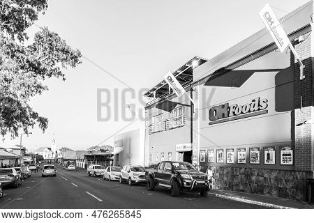 Prieska, South Africa - Feb 28 2023: A Street Scene, With A Supermarket, People, Vehicles And A Chur