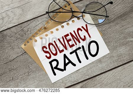Torn Paper With Text Solvency Ratio Near Glasses .basic Concepts Of Finance.business Theme.financial