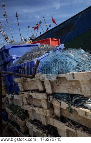 Chlopy, West Pomeranian - Poland - 2023: Fishing Port - Fish Boxes And Fishing Nets On The Backgroun