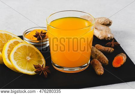 Turmeric Tea, Healthy Beverage With Turmeric Root And Spices, Jamu Juice, Immunity Booster Drink On