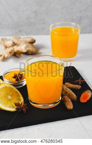Turmeric Tea, Healthy Beverage With Turmeric Root And Spices, Jamu Juice, Immunity Booster Drink On