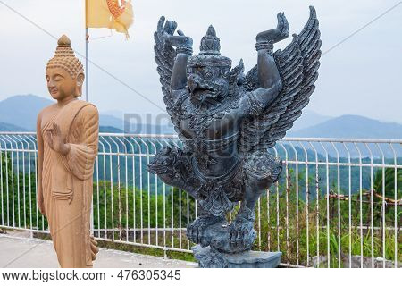 Black Statue Of Garuda King Of Birds In Buddhism Installed Near Big Buddha Statue In Phuket Thailand