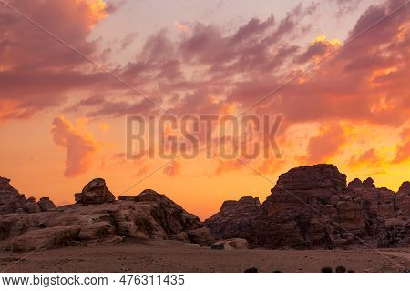 Sunset Colorful Orange Sky Landscape With Sandstone Rocks In Little Petra Archaeological Site, Jorda
