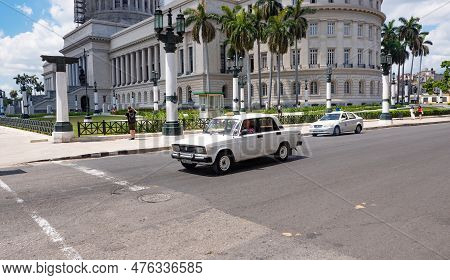 Havana, Cuba - May 02, 2019: National Capitol Building With Moskvitch Azlk Car