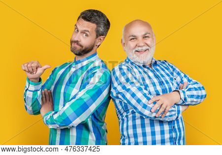 Smiling Two Generation Family Men On Background. Photo Of Two Generation Family Men