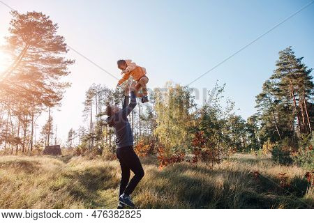 Happy Fathers Day. Dad And Son On A Walk In The Forest In Sunny Weather. Family Leisure. The Father 